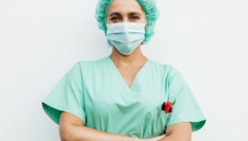 Woman Wearing a Scrub Suit Standing with Arms Crossed